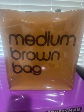 Bloomingdale's Brown Transparent Tote with Dark Brown Text with 2 bag charms
